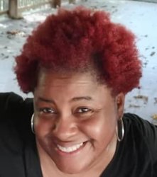 MsDDom with black shirt, and reddish afro.