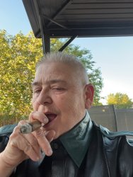 Jayson DaBoi smoking a cigar